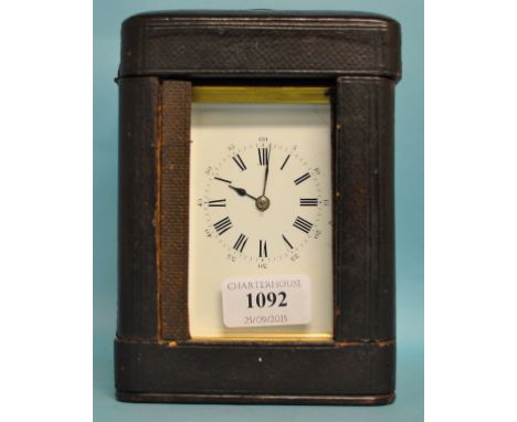 A carriage clock, with repeat, the 7 cm wide enamel dial with Roman numerals, fitted an eight day movement, striking on a gon