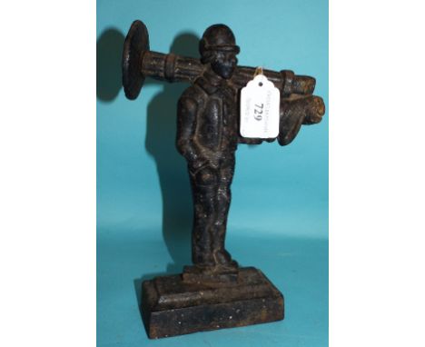 A cast iron door stop, in the form of a chimney sweep, 23.5 cm high
