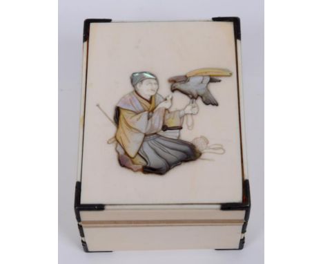 A Japanese ivory box, with Shibayama decoration of a kneeling gentleman with a bird of prey, 10.5 cm wide  See illustration C