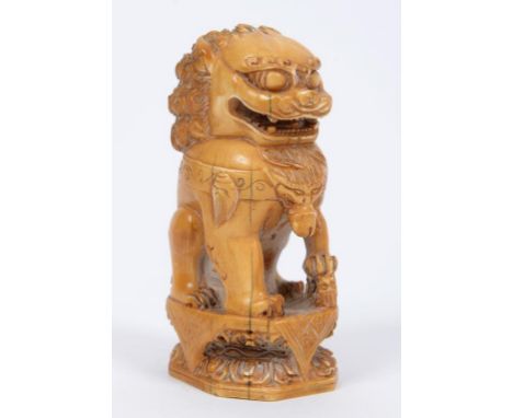 A Chinese carved ivory seal, in the form of a Dog of Fo (chipped), 10 cm high  See illustration