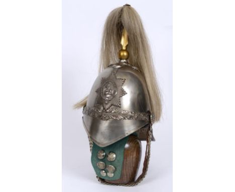 A Montgomeryshire Yeomanry Cavalry helmet, with chin strap, and six buttons  See illustration