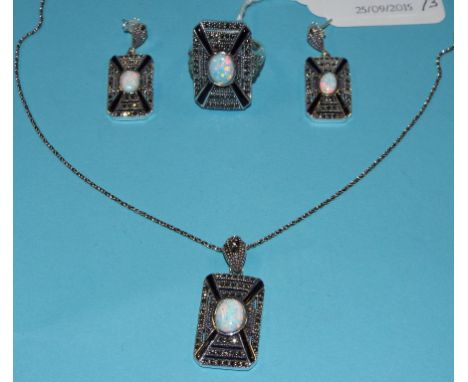 An Art Deco style opal, onyx and marcasite ring, and matching items (3)