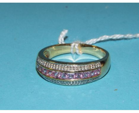 A 9ct gold, pink sapphire and diamond band ring Condition report Report by NG

Approx. ring size O½
