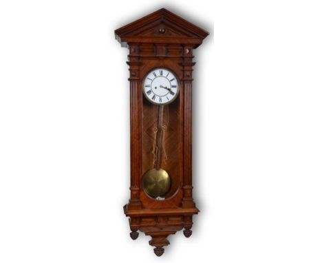 A Vienna regulator style wall clock, the 17.5 cm diameter enamel dial with Roman numerals, in a walnut architectural style ca