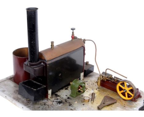A Stuart steam plant, with a horizontal brass boiler with chimney, water tank with pressure gauge, dynamo and a horizontal mi