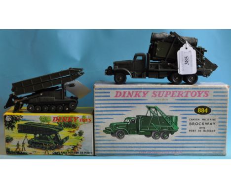 A Dinky Toys Char AMX Poseur De Pont, 883, and a Dinky Supertoys Camion Militaire Brockway Avec Pont De Bateaux, 884, both bo