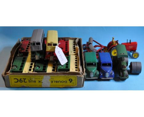 A Dinky Toys trade box of six Double Deck busses, 29C, a Massey-Harris Tractor, 27A, two Trojan Vans, 31A, and other Dinky To