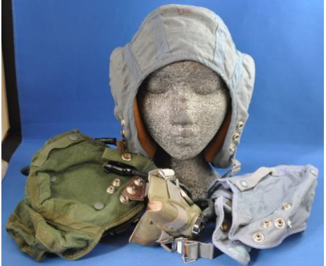 An RAF issue green cloth flying helmet, with R/T connection and oxygen mask, and two other flying helmets (3)