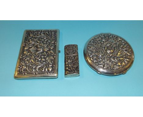 A silver coloured metal compact, stamped 800, a matching cigarette case and a similar lighter (3)