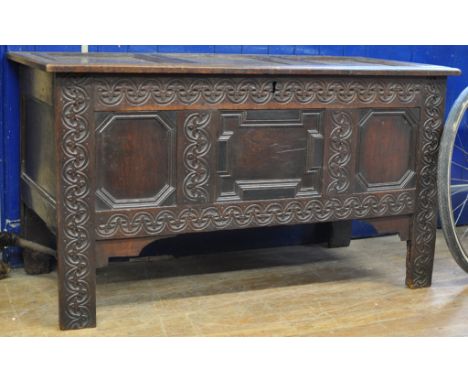A late 17th century carved oak coffer, with geometric moulded panel front, 128 cm wide