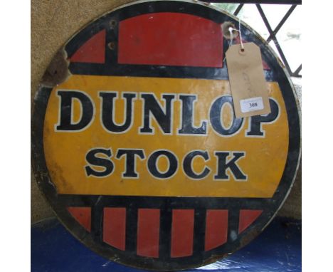 A double-sided enamel advertising sign, DUNLOP STOCK, some enamel losses and crazing, 46 cm diameter