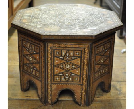 A Moorish style inlaid octagonal table (some loss), 58 cm wide Condition report Report by GH

The top has many areas of loss 