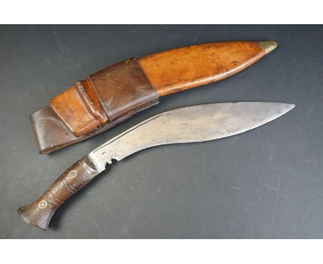 A British World War Two / WW2 military issue Gurkha kukri with leather scabbard, the blade marked 41 SNB, scabbard marked 194