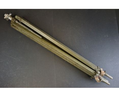 A British military issued tripod, adjustable height, painted in NATO green, broad arrow marked.