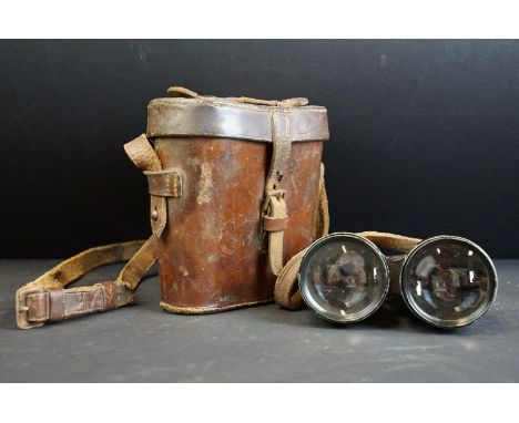 A pair of Dolland of London World War One / WW1 military issued field binoculars, MK.V Medium, No.11857, complete with leathe