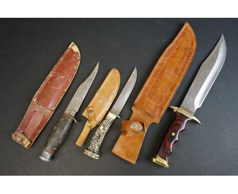 A collection of three hunting / scouting sheath knives to include a William Rodgers example, all complete with leather sheath