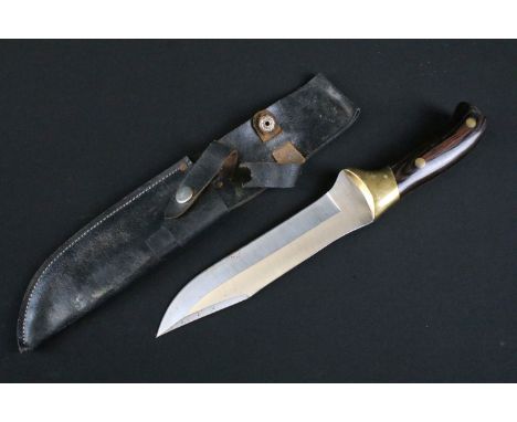A contemporary hand crafted hunting / sporting knife, crafted by M. Nieto of Japan, steel blade with two piece riveted wooden