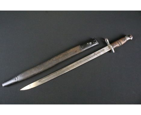 A British World war One 1913 pattern Bayonet by Remington, blade broad arrow marked, wooden two piece handle, complete with l