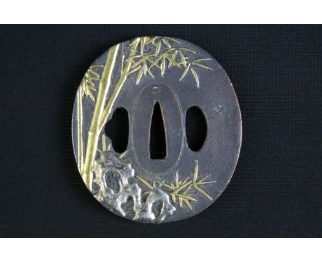 A Japanese Tsuba sword hand guard, bronze with highlighted bamboo decoration.