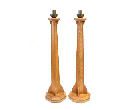 A Pair of Arts and Crafts English Oak Candlesticks, designed by Peter Johnson, made by Thompson &amp; Jackson of Lancaster an