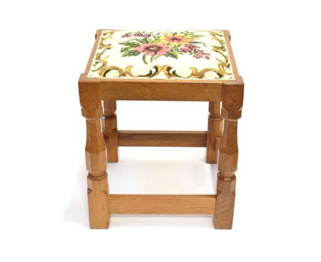 Mouseman: A Robert Thompson of Kilburn English Oak Stool, upholstered tapestry seat, on four octagonal legs joined by stretch