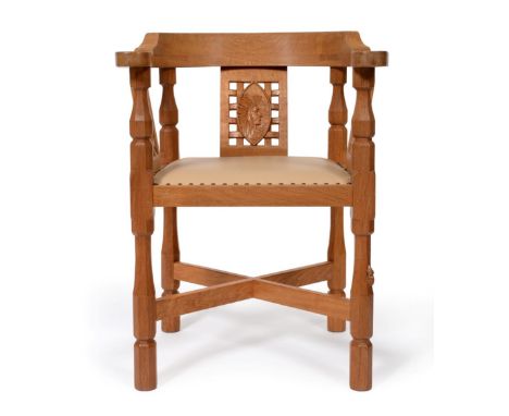 Mouseman: A Robert Thompson of Kilburn English Oak Monk's Chair, with curved back and shaped arms, over three panels, the cen