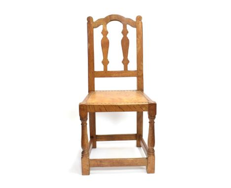 Mouseman: A 1920's Robert Thompson of Kilburn English Oak Chair, with shaped top rail, vase splats, the uprights with carved 