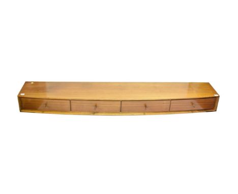 A Danish Teak Hanging Shelf, with four drawers, unmarked, 156cm wide, 30.5cm deep, 14.5cm high