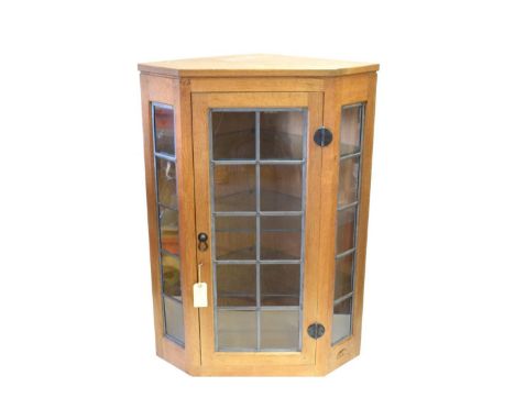 Mouseman: A Robert Thompson of Kilburn Glazed English Oak Hanging Corner Cupboard, the leaded glazed door and sides enclosing