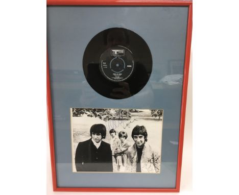 A framed and glazed signed black and white photo of The Who depicting Roger Daltrey, Pete Townshend, John Entwhistle and Keit