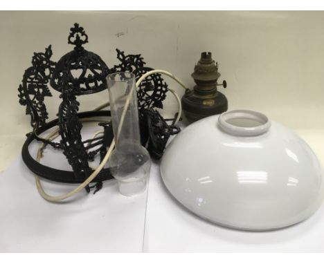 A hanging oil lamp converted to mains electric.
