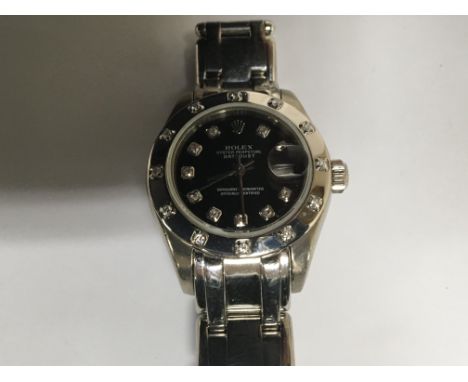 A Quality Ladies 18carat white gold Rolex Oyster Perpetual DateJust Superlative Chronometer. With orgional Rolex diamond set 