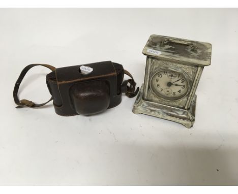 Old brass cased German clock and cased German Paxina camera.
