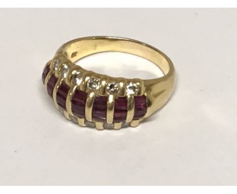 An 18carat Gold ruby and diamond ring. Ring size S.