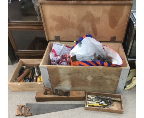 A large wooden tool chest containing a large quantity of old tools including planes  and chisels
