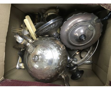 A collection of silver plated items to include teapot, candle sticks, cutlery etc.