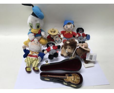 A collection of teddy bears including Noddy, Big Ears, miniature guitar with case, 2 gollys and a Donald Duck.