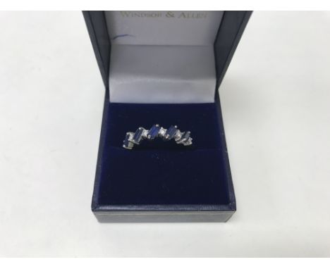 An 18ct fine sapphire and diamond ring with 5 princess cut sapphires and 0.30 carat of diamonds. Weight approx 4g, size appro