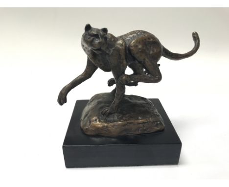 A bronze figure of a cheetah. Height approx 13cm