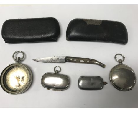 A collection of oddments including sovereign cases, a knife, glasses cases and compass.