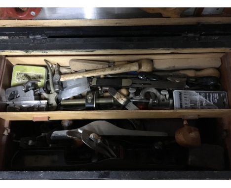 A collection of woodworker and cabinet makers tools including steel wood plains chisels etc in three fiited