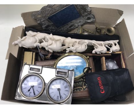 A box of various oddments including carriage clock cases, desk clocks, a camera and brass items.