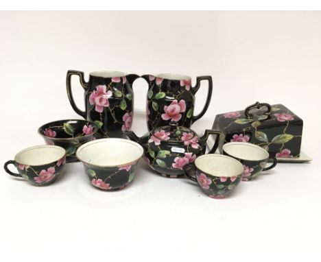 A hand painted circa 1920s Till & Sons tea set decorated with black fill background accentuated with pink roses, comprising o