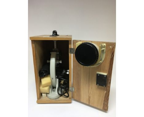 A wooden cased Chinese microscope