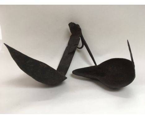 A circa 1800 Scottish double crusie iron lamp.