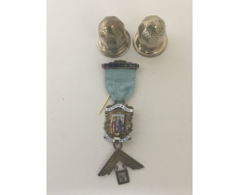 A silver and enamel Masonic Jewel and two silver condiments. (3)