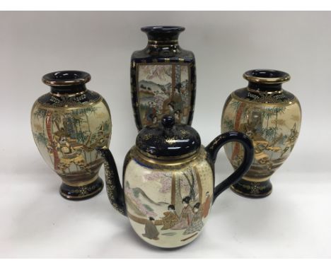 A pair of satsuma vases plus one other and a teapot (4).