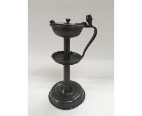A Victorian pewter whale oil lamp, monogrammed FGS 1847, believed to have been formerly used in a convent, approx 22cm.