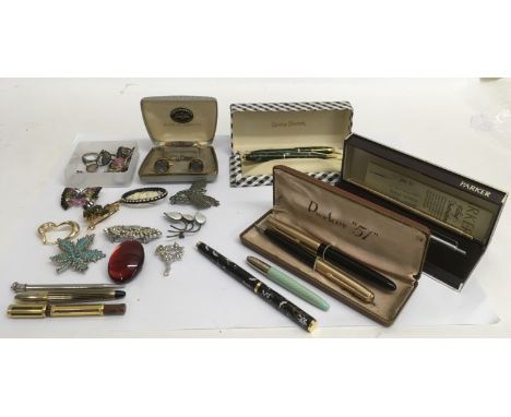 A small group of pens and costume jewellery including a vintage boxed Conway Stewart set,  a USA example and a Norwegian enam