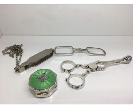 Three silver items comprising a pair of lorgnettes, tongs and continental enamel pill box